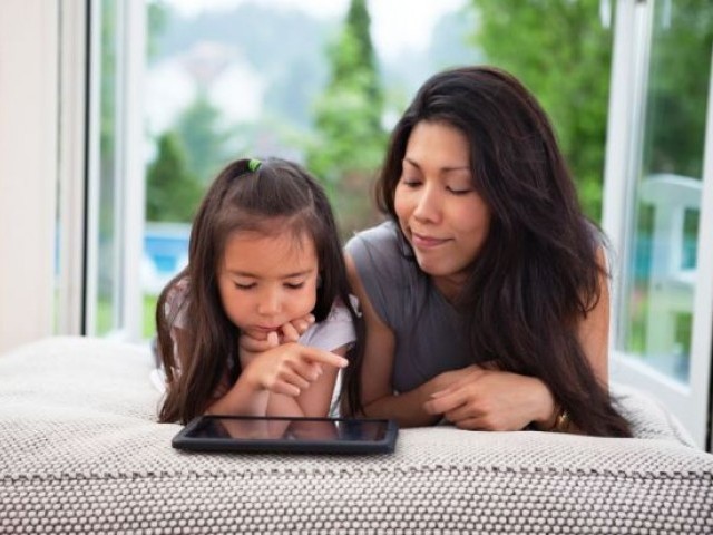 According to researchers, parents should find a balanced way to monitor their children's internet use. PHOTO: AFP