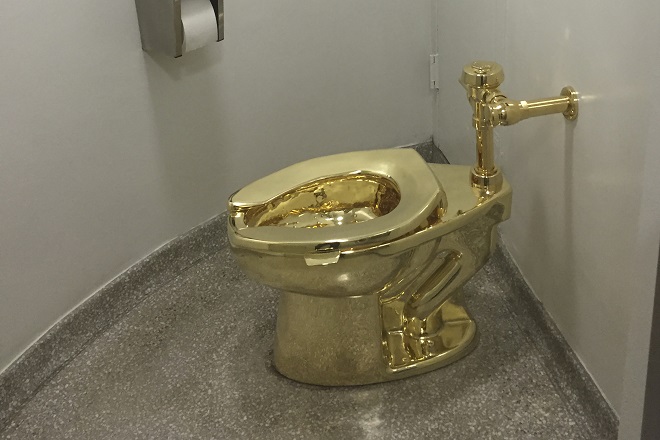 File photo of fully functioning solid gold toilet, made by Italian artist Maurizio Cattelan. PHOTO: AFP