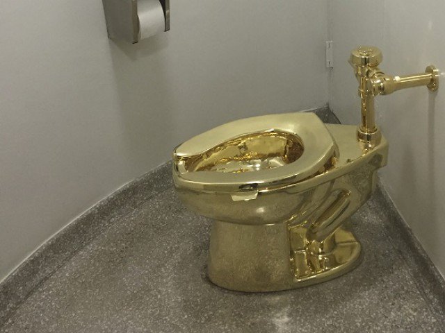 File photo of fully functioning solid gold toilet, made by Italian artist Maurizio Cattelan. PHOTO: AFP/FILE