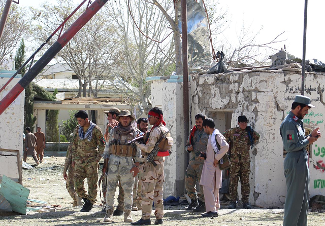 Afghan security forces stand at the site of a car bomb attack in Qalat, capital of Zabul province, Afghanistan September 19, 2019. PHOTO: REUTERS