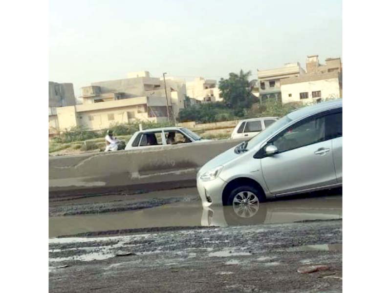 National Highway has been reduced to a decaying thoroughfare, with deep pits formed along its length, as a result of the clogged drainage system. And yet, civic agencies’ negligence towards the restoration of the road has persisted. PHOTO: EXPRESS