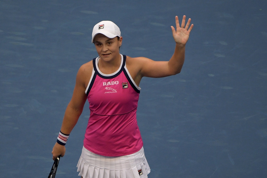 FULL OF FAULTS: Barty committed 52 unforced errors but still just about emerged victorious in a nervy 6-3, 3-6, 7-6 (9/7) triumph in Beijing. PHOTO: AFP