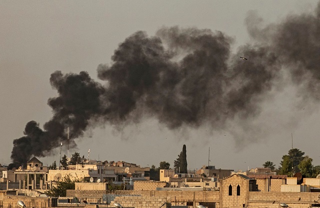 Smoke billows following Turkish bombardment on Syria's northeastern town of Ras al-Ain in the Hasakeh province along the Turkish border on October 9, 2019. PHOTO: AFP