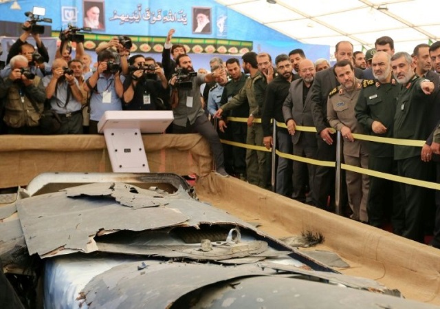 Iran has put what it says is the debris of a US drone it shot down over the Gulf in June on display in a special exbition in Tehran. PHOTO: AFP/FILE