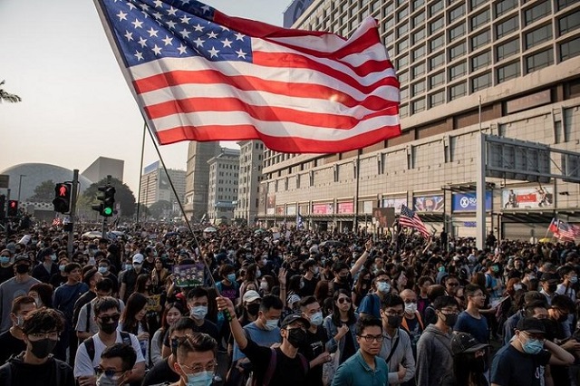 People take part in a march from the Tsim Sha Tsui district to Hung Hom in Hong Kong. PHOTO: AFP