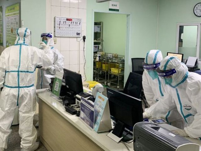 Medical staff members wearing protective suits at the Zhongnan hospital in Wuhan in China's central Hubei province. PHOTO: AFP