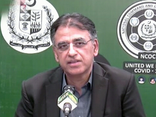 Planning Minster Asad Umar addresses a news conference in Islamabad. SCREENGRAB