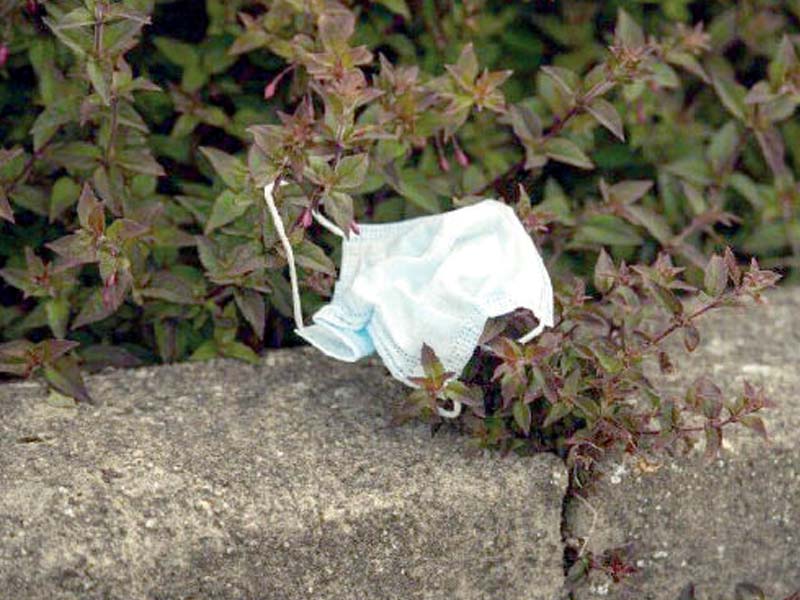 Discarded face masks and gloves, increasingly used to avoid exposure to Covid-19, are often disposed of without a second thought about how they may spread the virus further in the community. PHOTOS: REUTERS/AFP