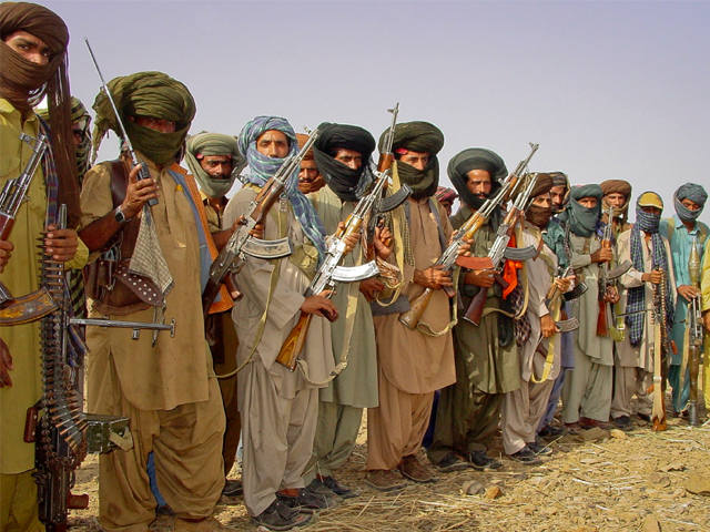 Baloch rebels holding their weapons as they pose for a photograph at an undisclosed location in Balochistan. PHOTO: REUTERS