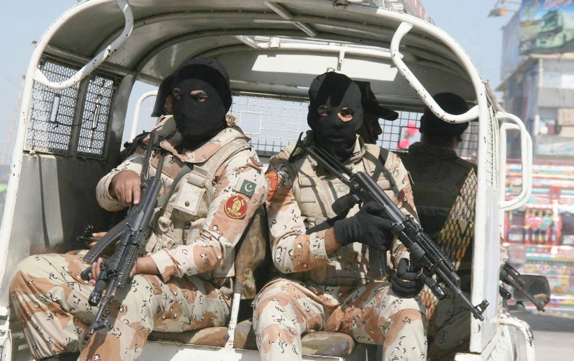 Rangers in Karachi carrying out an operation in the city on Wednesday. PHOTO: EXPRESS