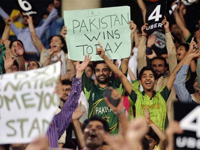 Pakistan fans celebrate cricket's return to the country. PHOTO: AFP
