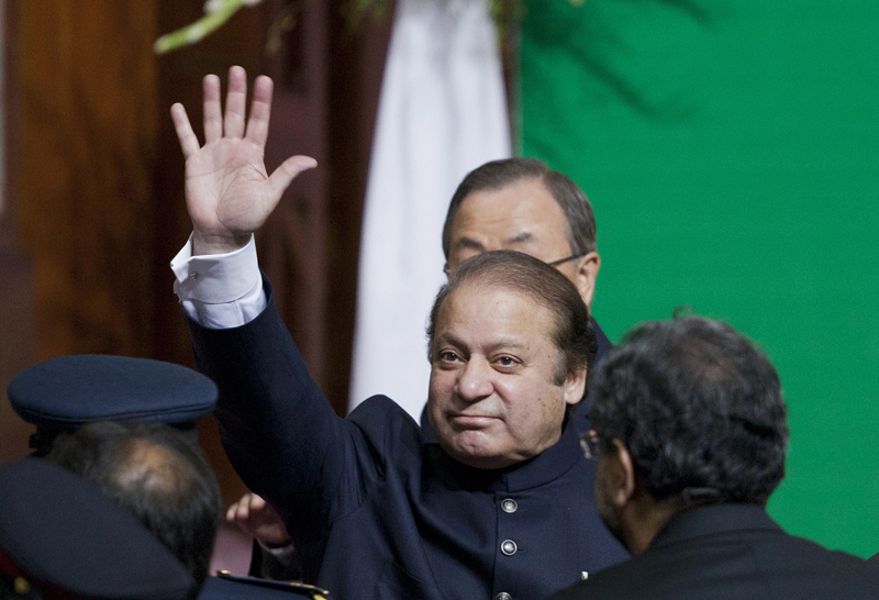 Prime Minister Nawaz Sharif waves to the crowd as he leaves after attending a flag raising ceremony to mark the country's 67th Independence Day in Islamabad August 14, 2013. PHOTO: REUTERS
