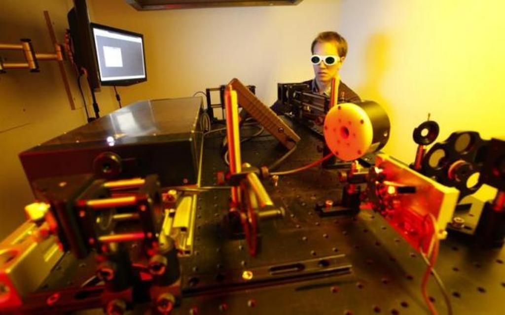 A dissertation student operates a newly developed 3D laser printer. PHOTO: REUTERS