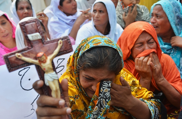 The report also called 2013 "one of the darkest years" for Christians in Pakistan, with the deadliest ever attack on the community mounted in Peshawar in September. PHOTO: AFP/FILE