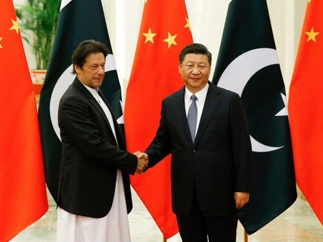 China's President Xi Jinping shakes hands with Prime Minister Imran Khan ahead of their meeting at the Great Hall of the People in Beijing on November 2, 2018 PHOTO:AFP