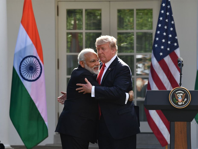 President Donald Trump and Indian Prime Minister Narendra Modi exchanged hugs in the White House Rose Garden in front of reporters. PHOTO: AFP