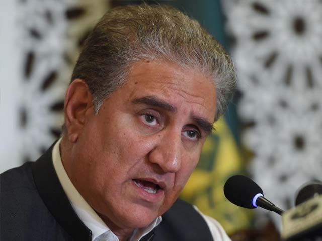 Pakistan's Foreign Minister Shah Mahmood Qureshi gestures as he speaks during a press conference focused on the Kashmir situation. PHOTO: AFP