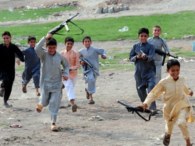 File photo of children playing with toy guns. PHOTO: AFP