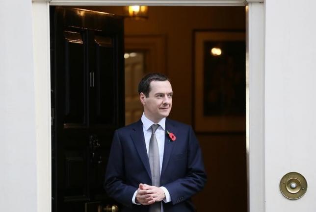 Britain's Chancellor of the Exchequer George Osborne stands outside 11 Downing Street to welcome Brazil's Finance Minister Joaquim Levy in central London, Britain, October 29, 2015. PHOTO: REUTERS