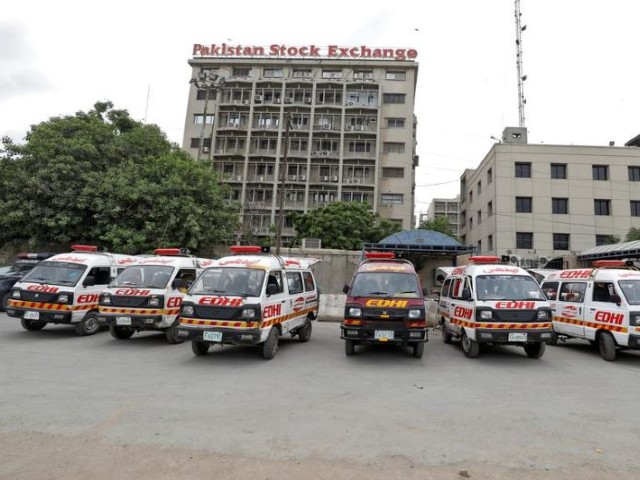 Ambulances are seen parked outside Pakistan Stock Exchange building after the terrorist attack in Karachi. PHOTO: REUTERS